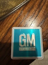 VINTAGE METAL GM GENERAL MOTORS TAG EMBLEM picture