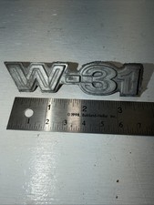 New OEM 406479 GM 1970 Olds Cutlass W-31 Diecast  Front Fender Emblem NOS picture