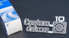 NOS GM 1975-80 Chevy Custom Deluxe 10 Emblem Nameplate Square Body OBS 14016633 picture