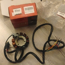 The selected item is an engine magneto stator with a multi-pole copper coil picture