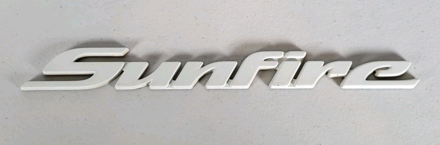 1998-2004 Pontiac Sunfire Emblem Badge Logo Nameplate White Vintage 1998-2004 Pontiac Sunfire Emblem Badge Logo Nameplate White Vintage