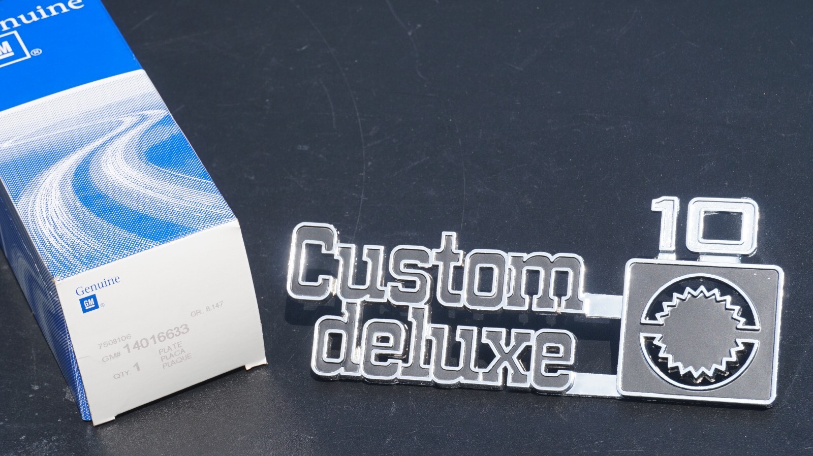 NOS GM 1975-80 Chevy Custom Deluxe 10 Emblem Nameplate Square Body OBS 14016633