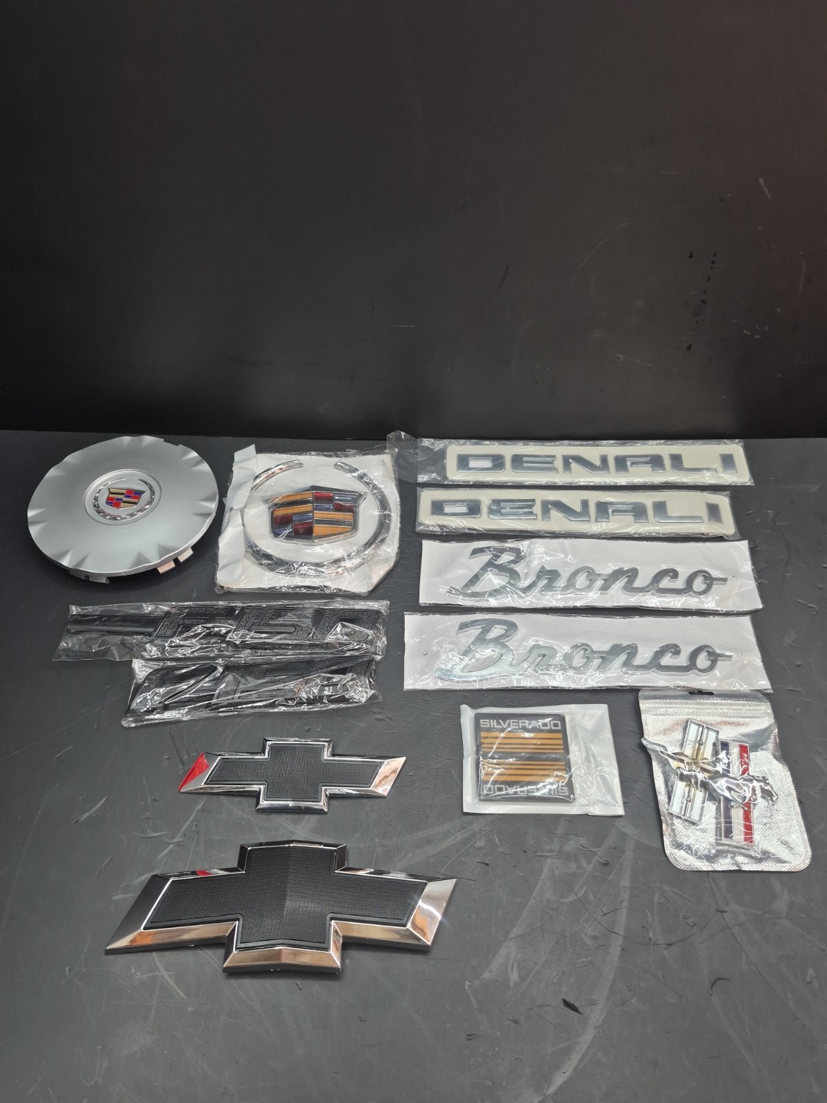 Car emblems badge logo for Cadillac Mustang Bronco F150 Chevy lot of 11 Open Box Car emblems badge logo for Cadillac Mustang Bronco F150 Chevy lot of 11 Open Box