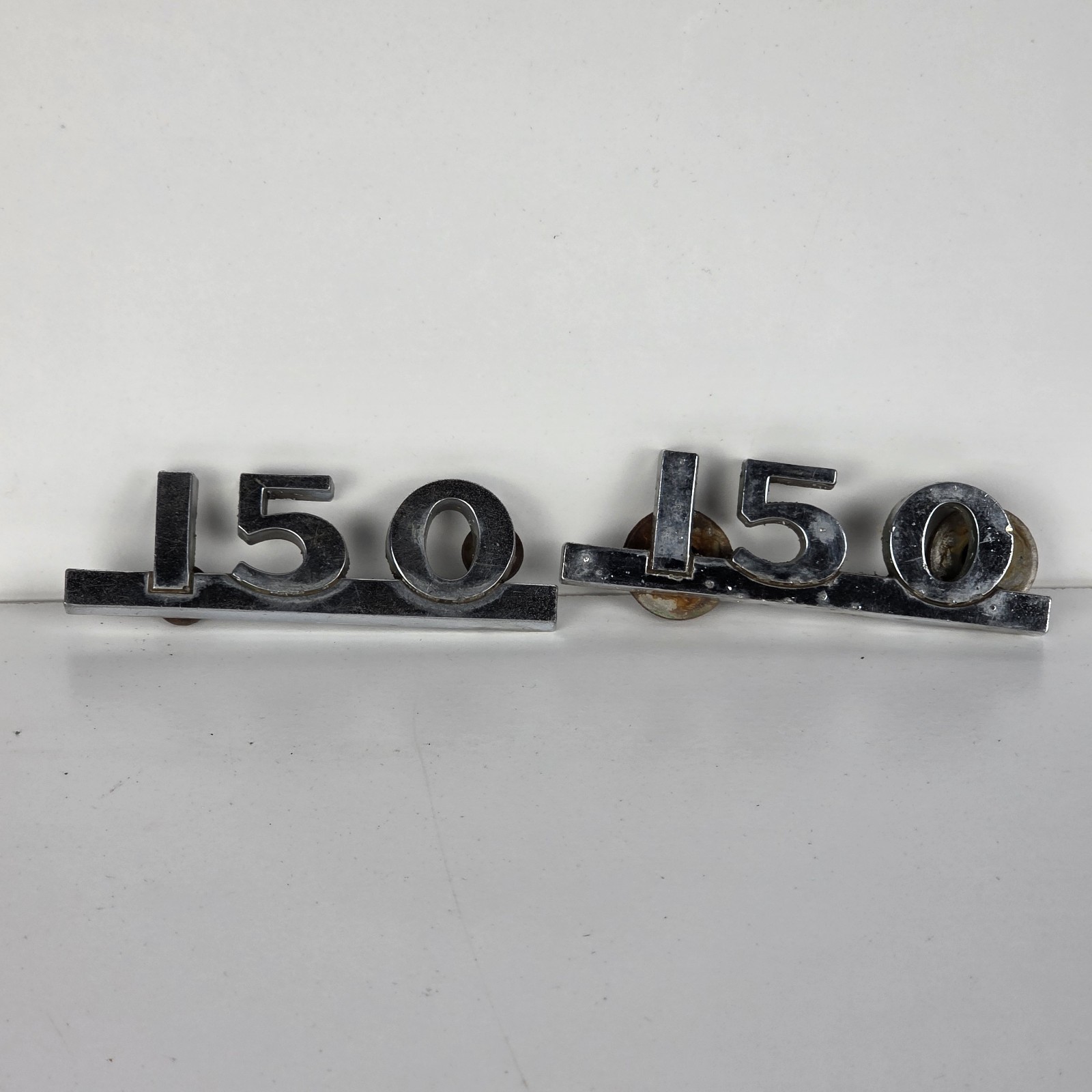 Pair of Vintage Metal 150 Emblems Pair of Vintage Metal 150 Emblems