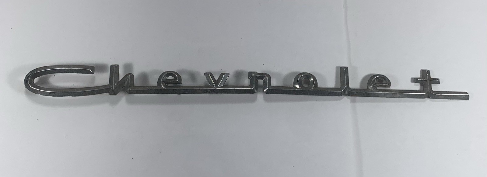 1957 Chevy 150 210 Fender Hood Quarter Panel Trunk Emblem Chevrolet Script OEM 1957 Chevy 150 210 Fender Hood Quarter Panel Trunk Emblem Chevrolet Script OEM