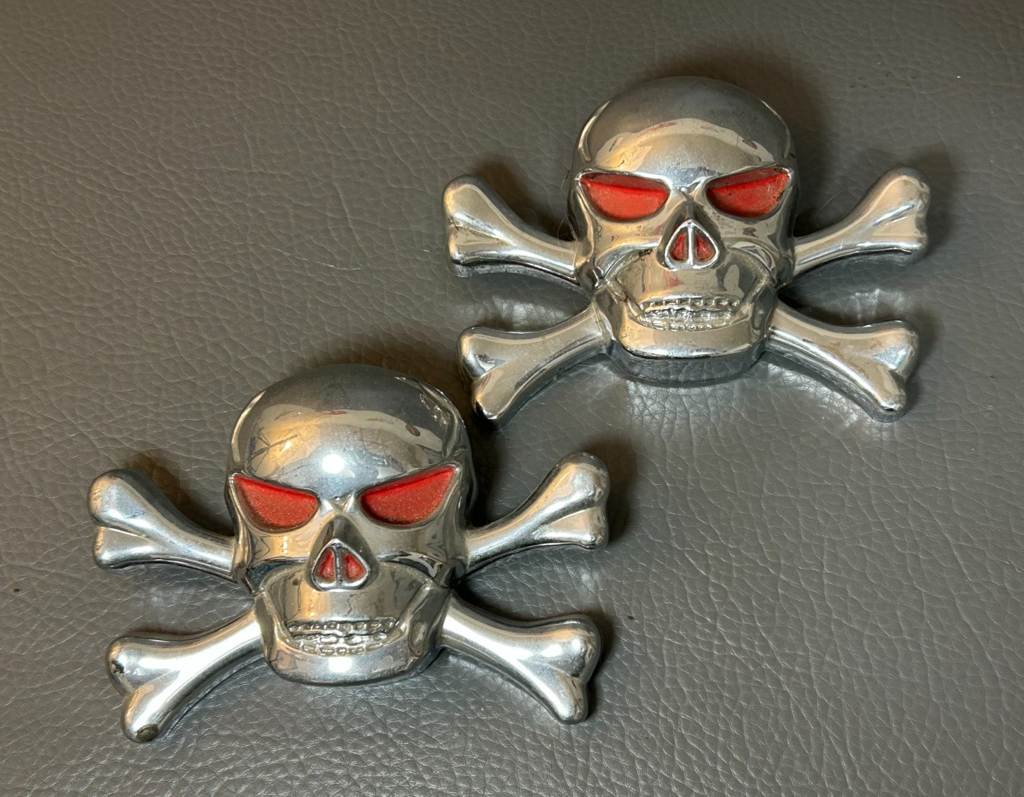 Two-Skull & Crossbones Emblems w/Red Eyes Chrome Plastic 6 inch Two-Skull & Crossbones Emblems w/Red Eyes Chrome Plastic 6 inch