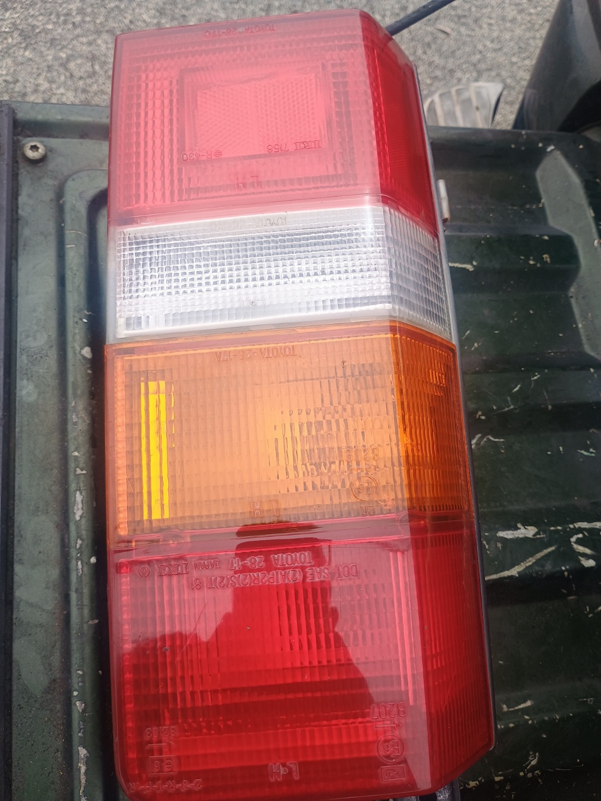 84-89 Toyota Van OEM Left Combination Tail Light Assembly, passenger, black