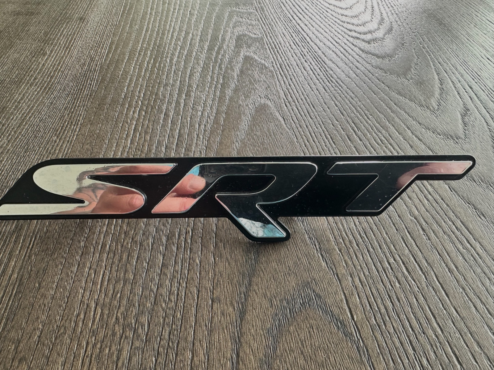 Genuine Mopar SRT Nameplate 68239550AD (From Challenger Hellcat front grille) Genuine Mopar SRT Nameplate 68239550AD (From Challenger Hellcat front grille)